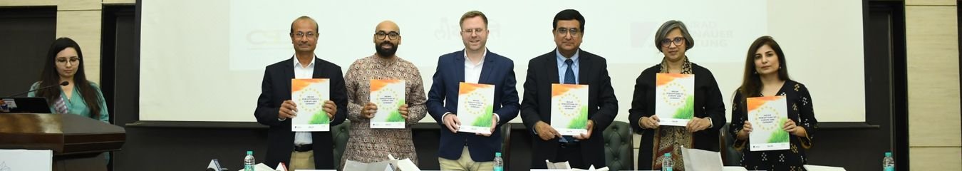 Speakers holding copies of the report at the launch of Indian Perceptions of Germany and Europe